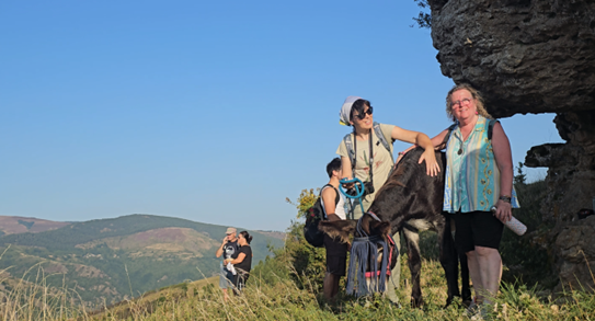 Evelyne and Andreja with donkey Obi at the top of the mountain overlooking the village of Ventajols and offering a splendid panoramic view